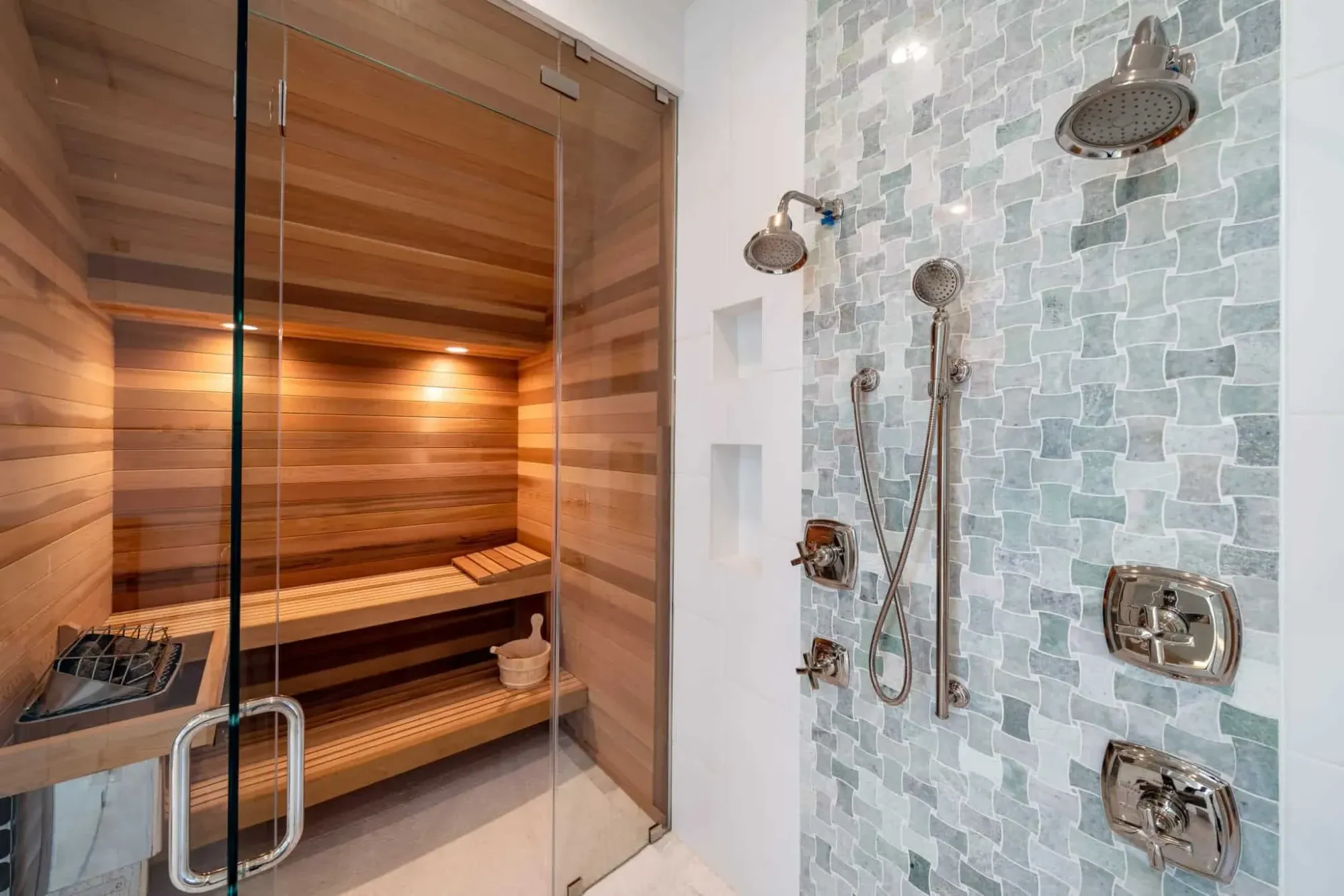 Spa-style walk-in shower in a luxury primary suite with scenic Hill Country vista