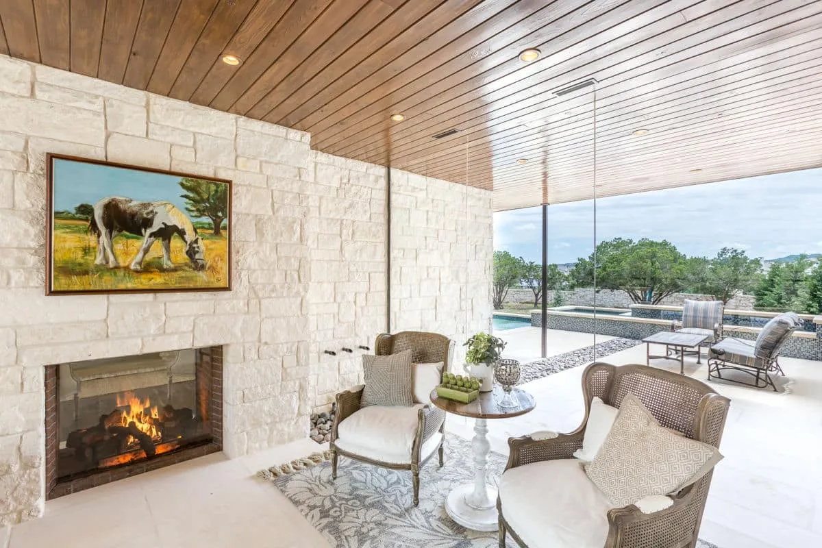 modern, farmhouse, wooden bench, lighting, large windows, wooden, lights, chairs, luxury, home, homes, custom homes, jenkins, hill country, stone, white stone, sliding door, glass windows, entryway, entrance, farm, rustic, wooden ceiling, stone floors, stone walls, cowboy, southern