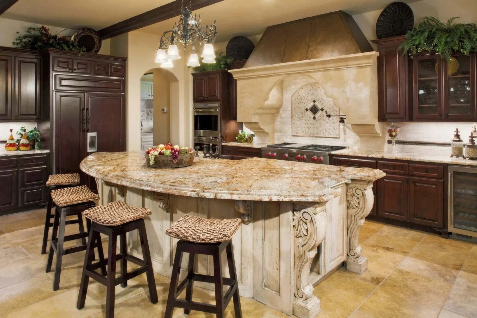 Kitchen island with granite top, carved corbels and dark cabinets, Mediterranean Parade Home