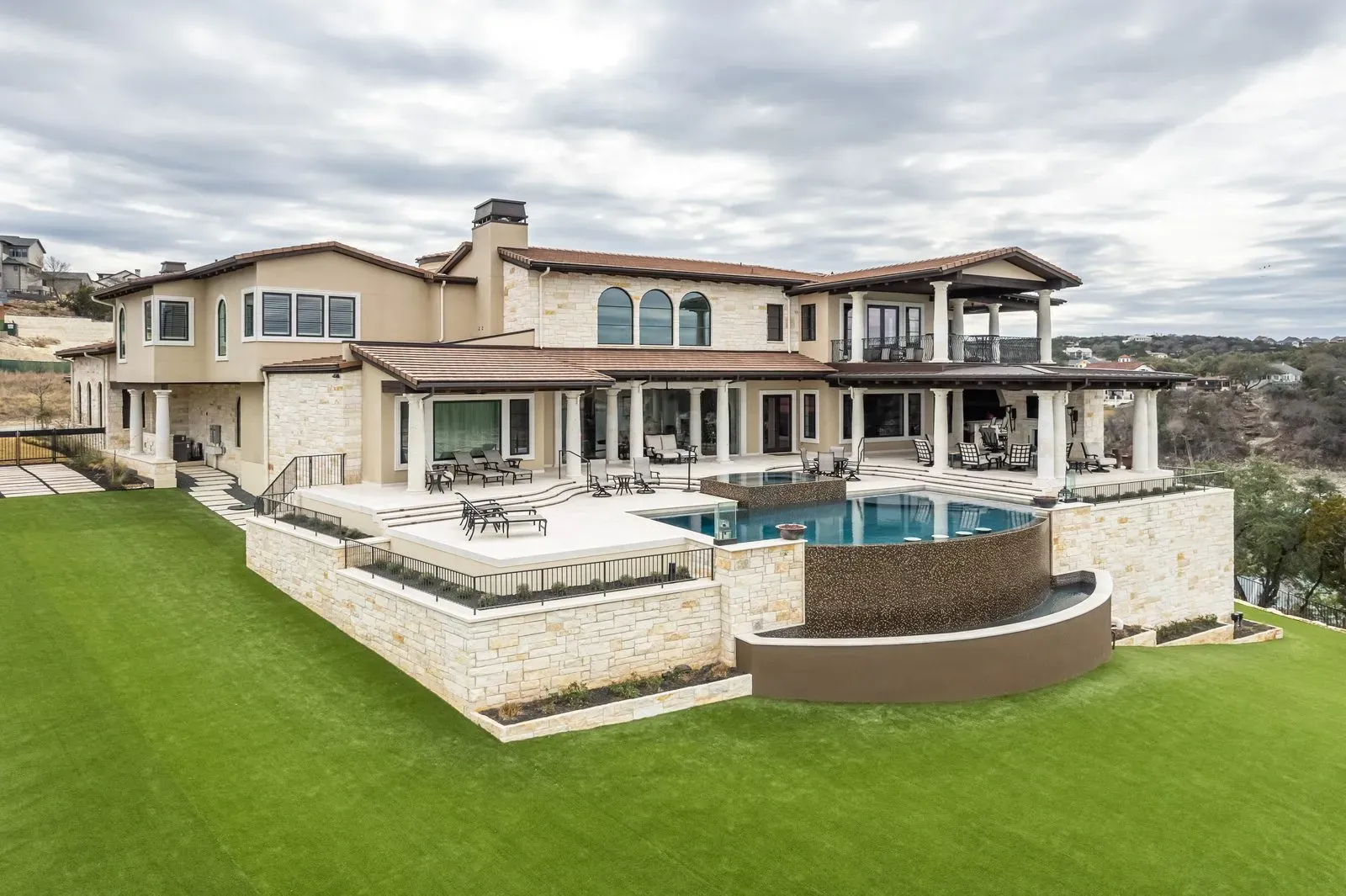 Modern Hill Country ranch architecture with architectural integrity and dark exterior detailing