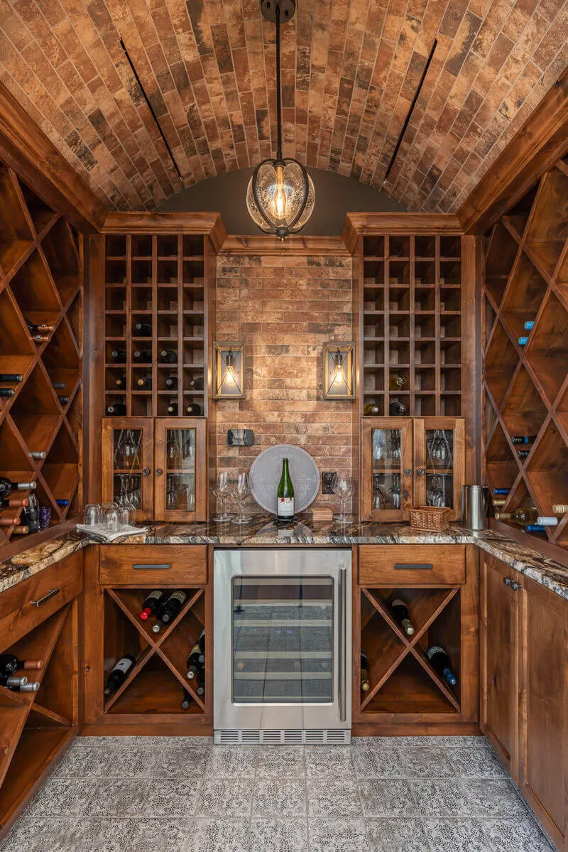 Hidden speakeasy wine cellar with arched brick ceiling