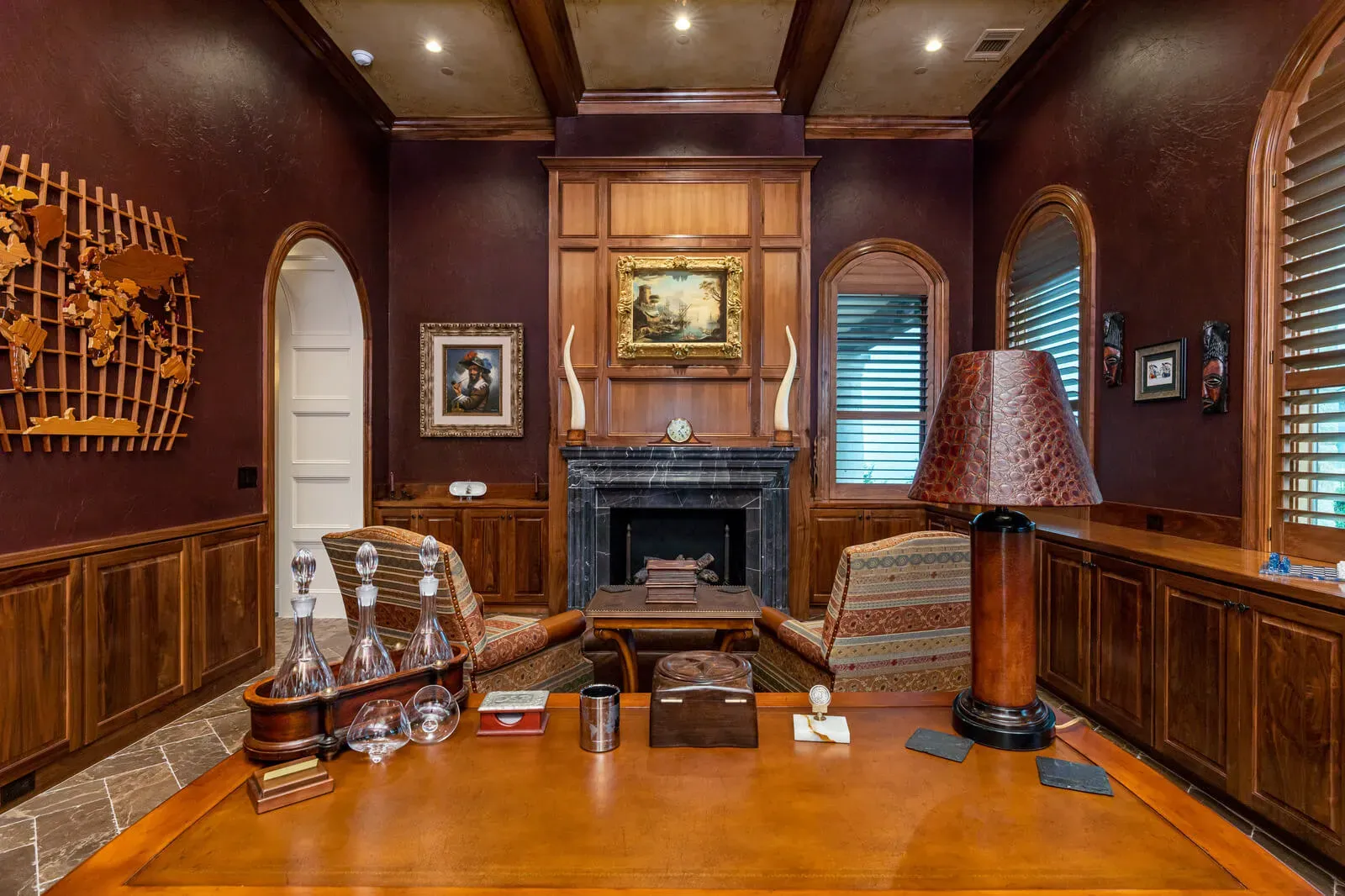 Luxury home office with dark wood walls and classic decor