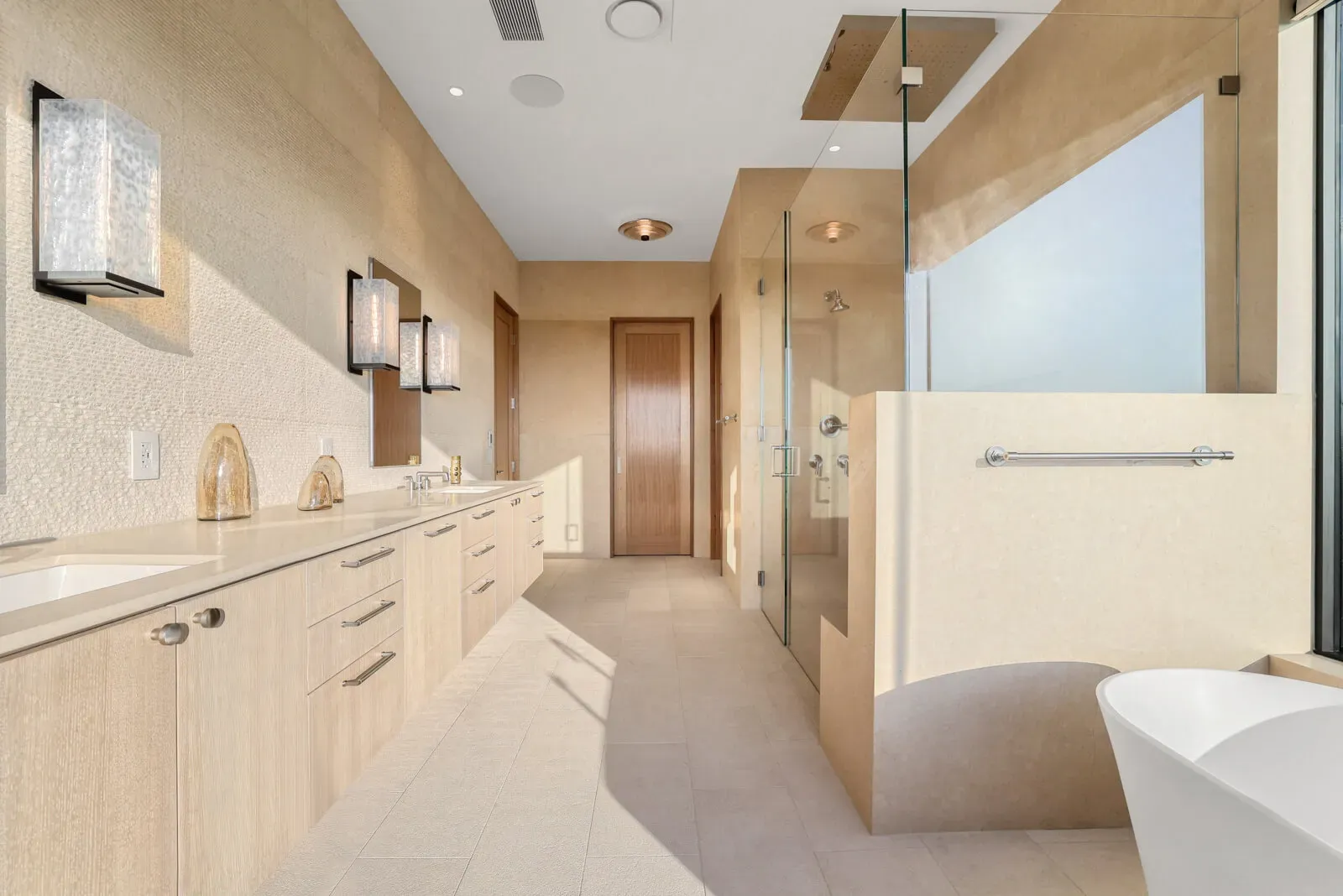 Light neutral luxury bathroom with double vanity and walk-in shower