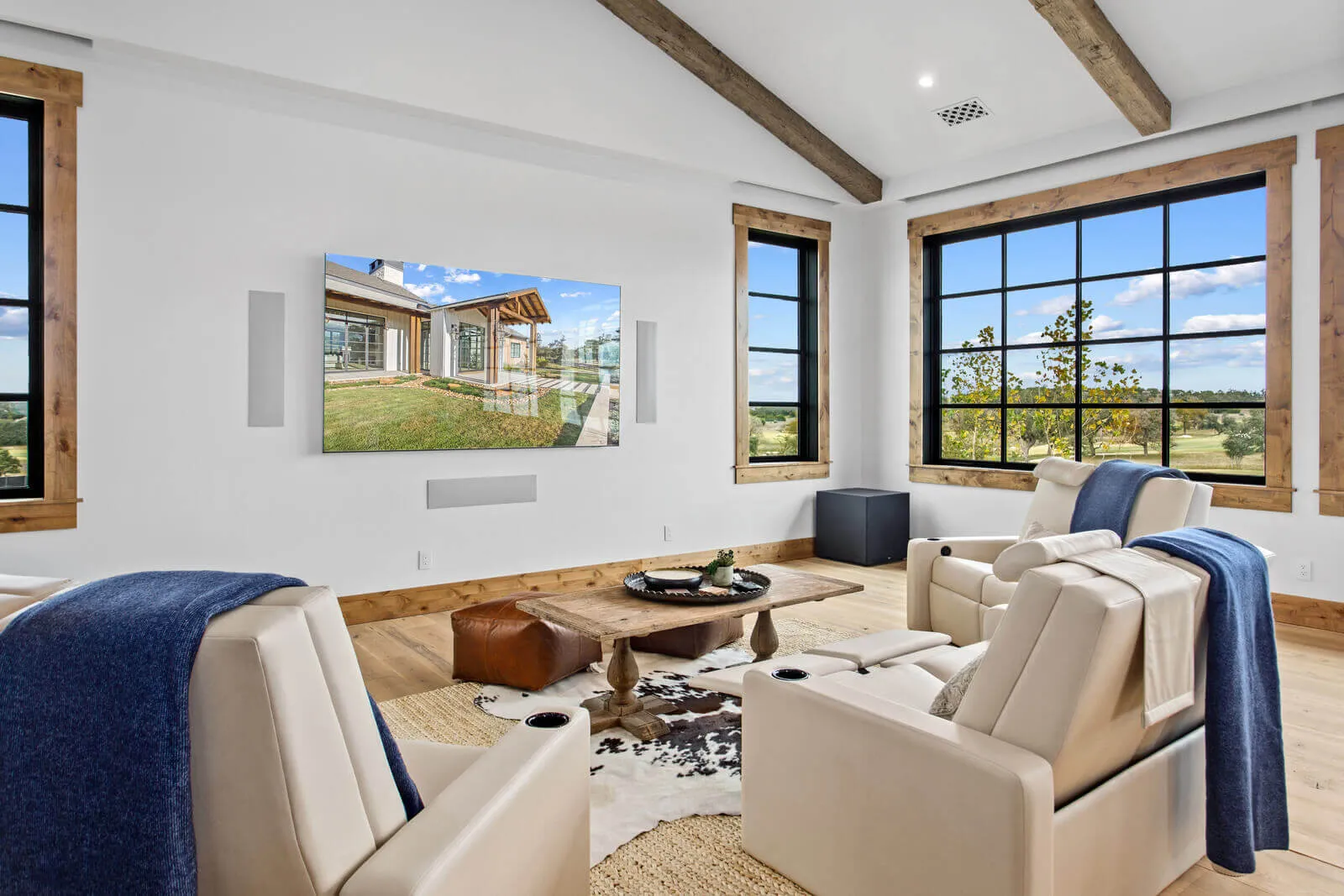 Modern Austin media room with leather recliners and large wall-mounted screen