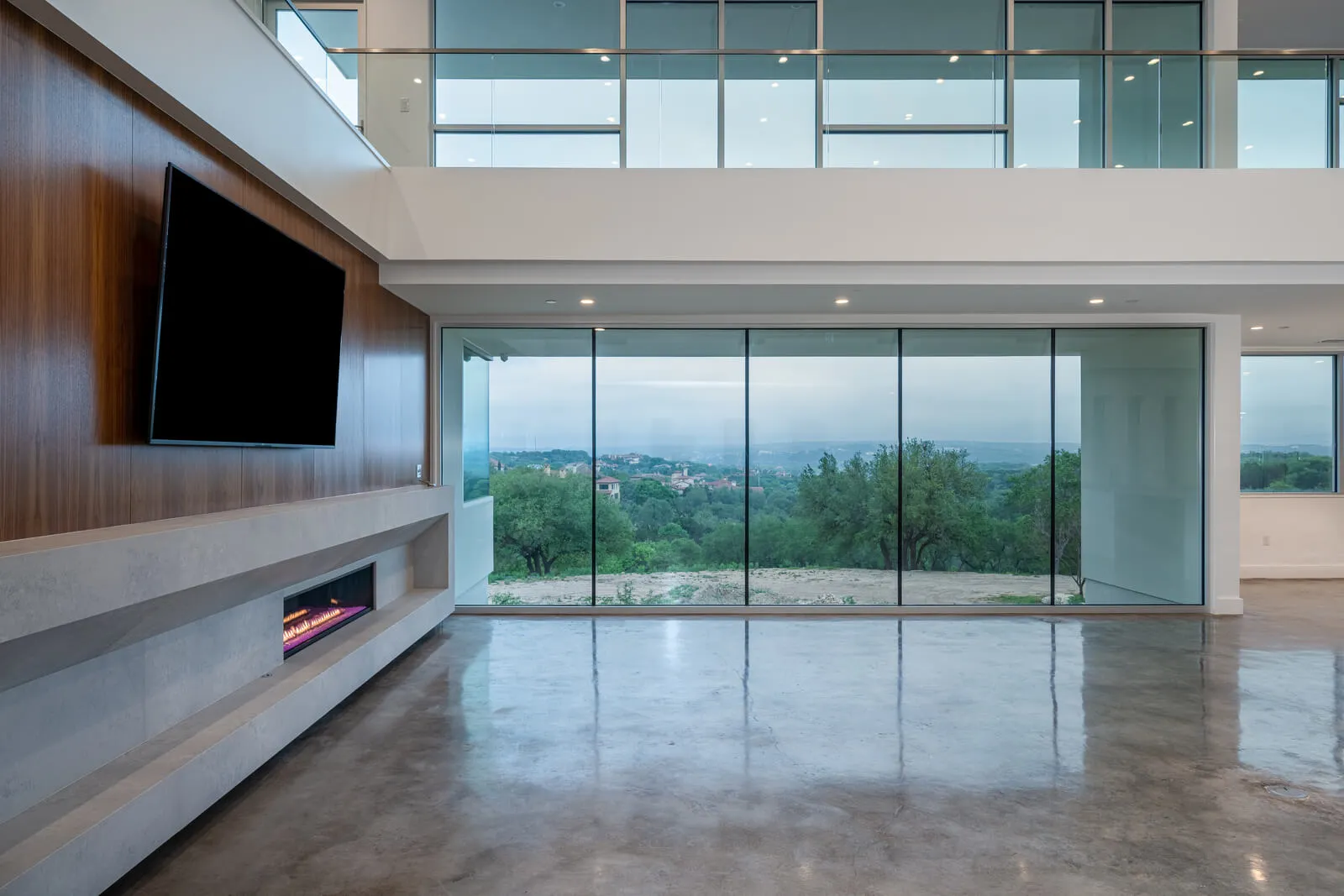 Floor-to-ceiling glass wall with Hill Country views in modern home