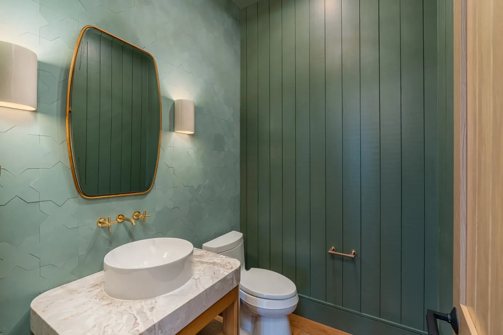 Modern powder room with green textured walls and vessel sink