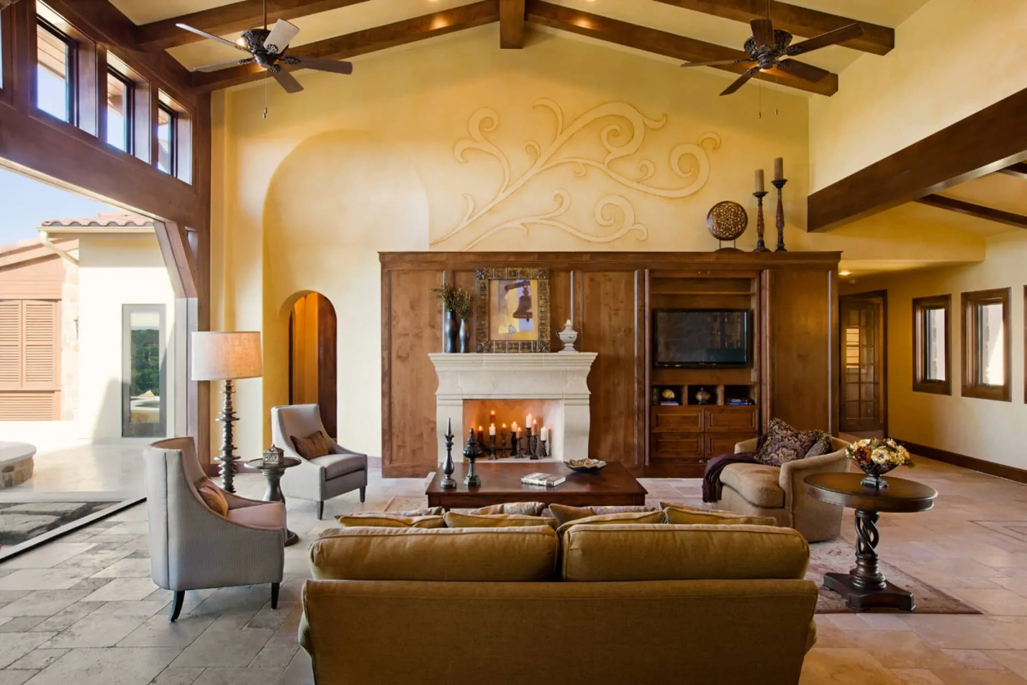 Great room from the sofa with beamed vaulted ceiling and two ceiling fans, Modern Mediterranean Parade Home