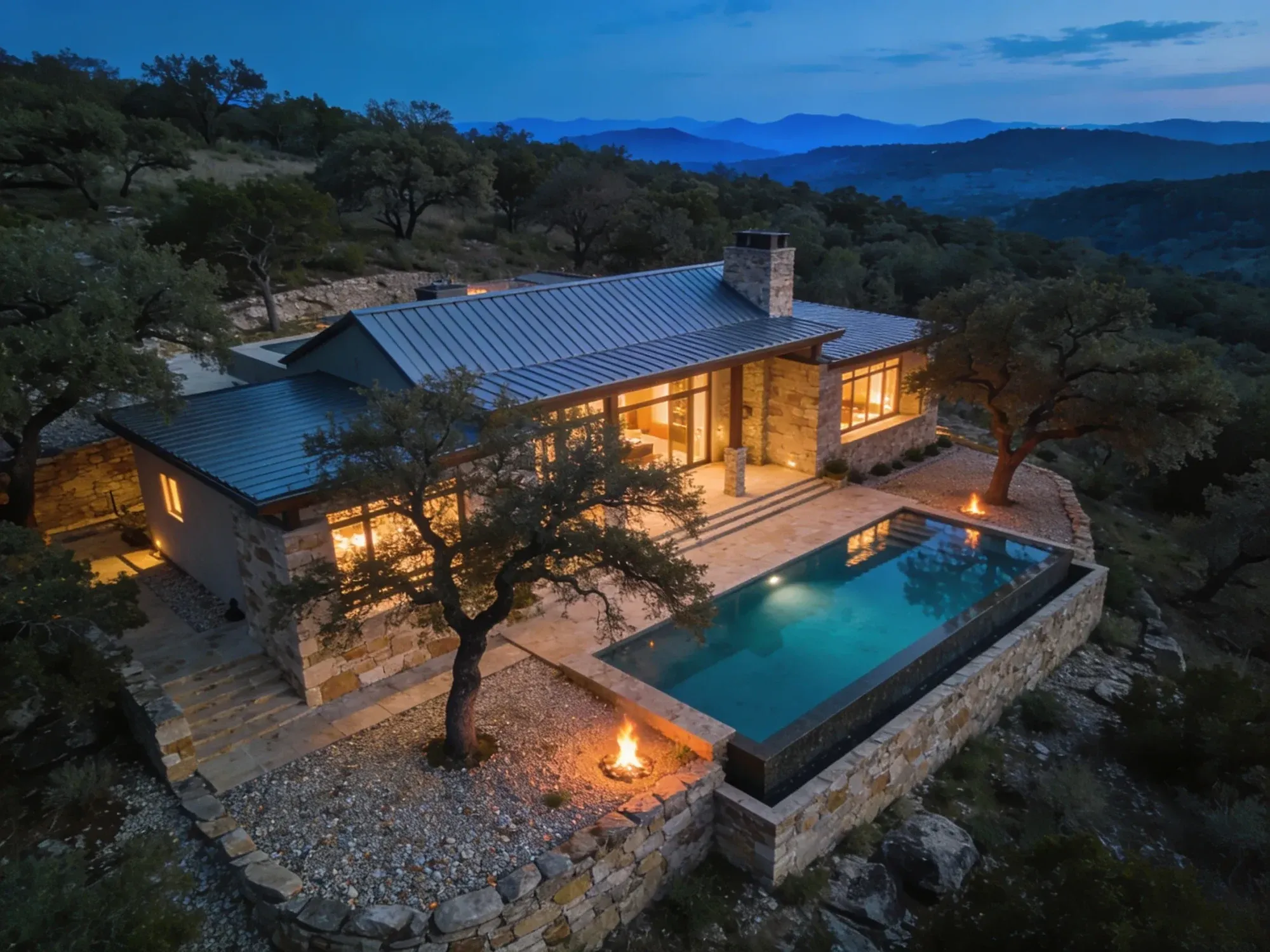 Hill Country aerial view showing the well-water source and rooflines of a luxury custom home