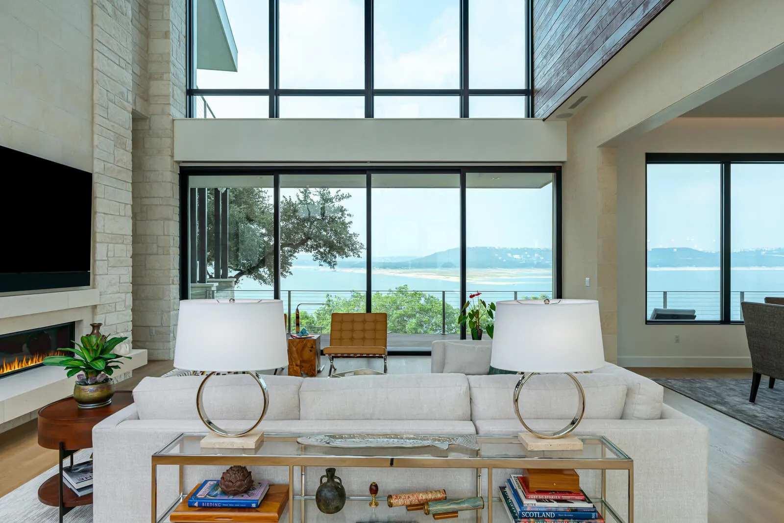 Window wall with panoramic Lake Travis views in luxury living room