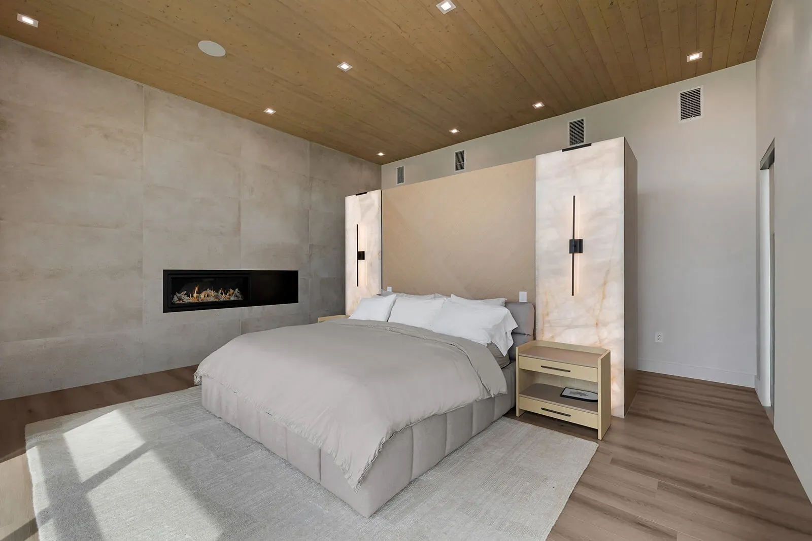 modern bedroom with wood flooring and soft lighting