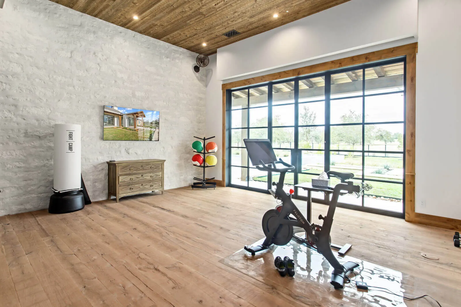 luxury home gym in Austin estate home with large windows and exercise space