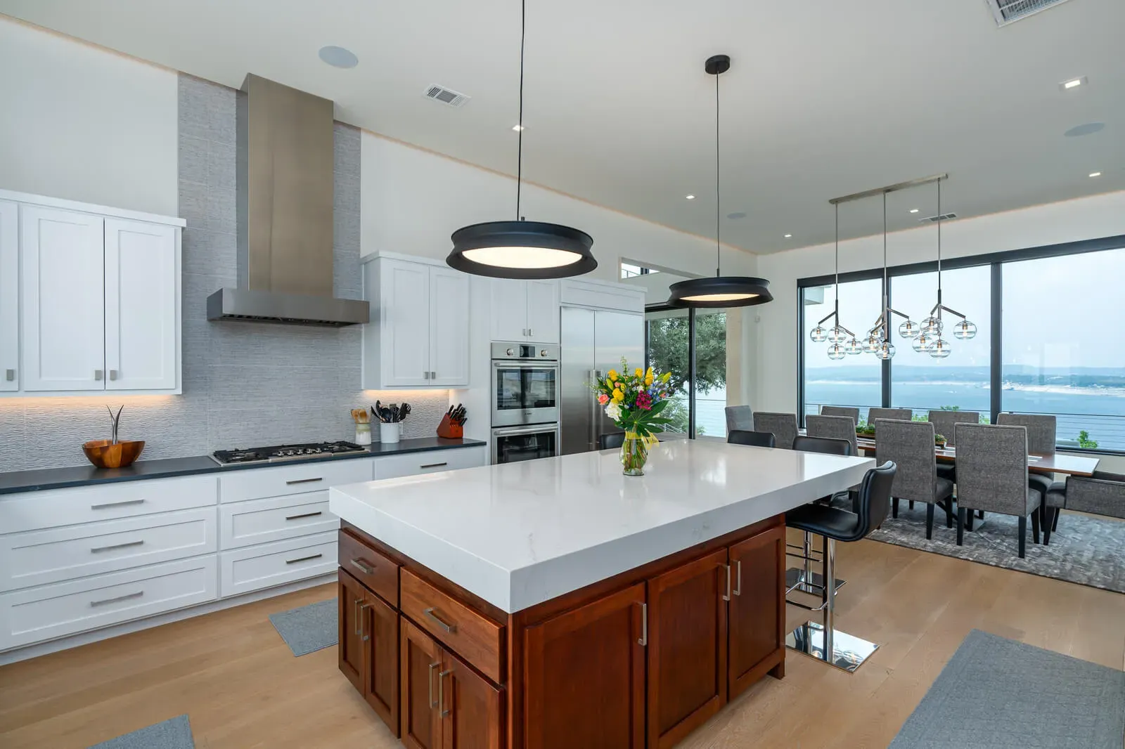 Timeless modern kitchen Austin with quartz island and pendant lighting overlooking Lake Travis