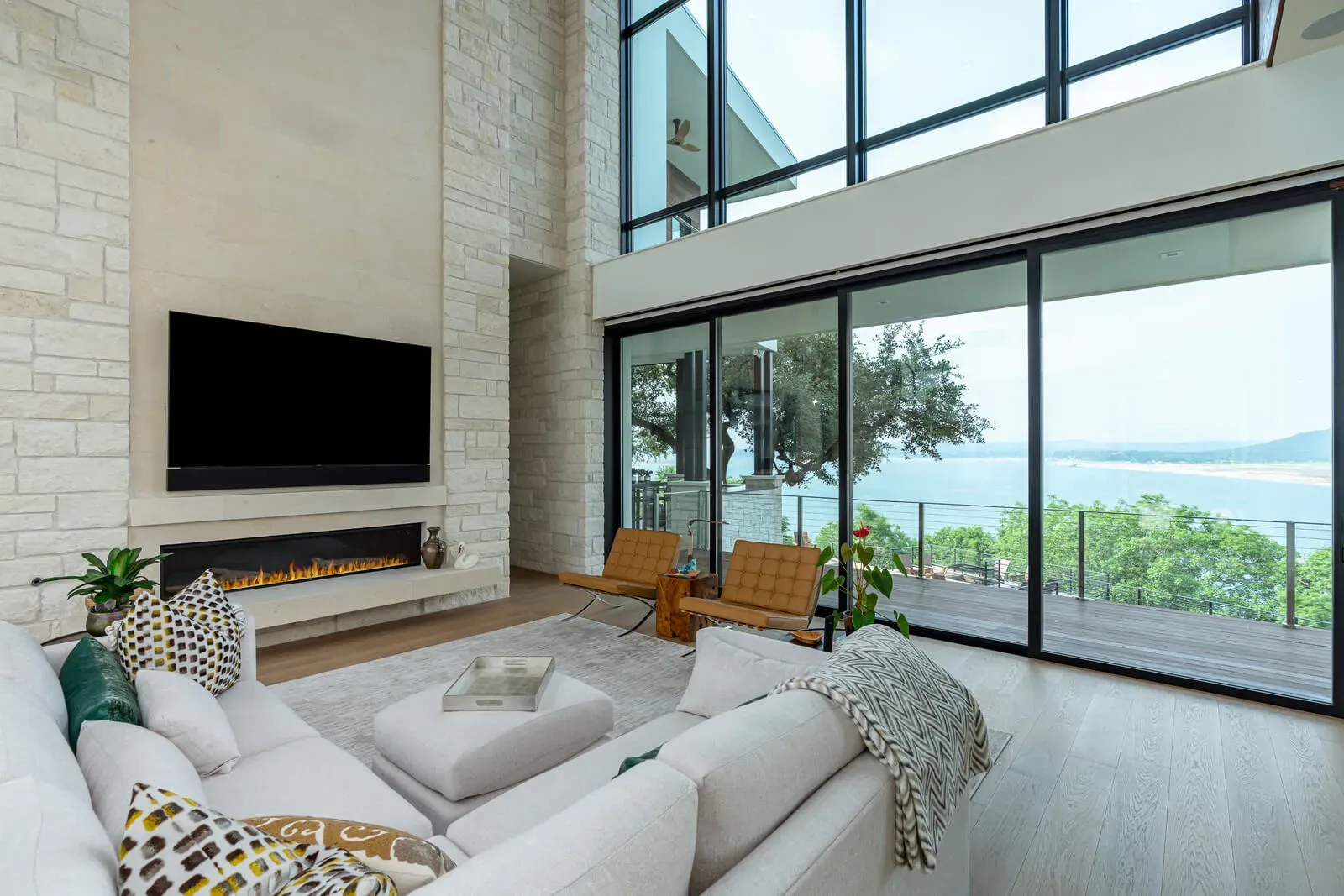 Modern Austin living room with floor-to-ceiling windows and linear fireplace