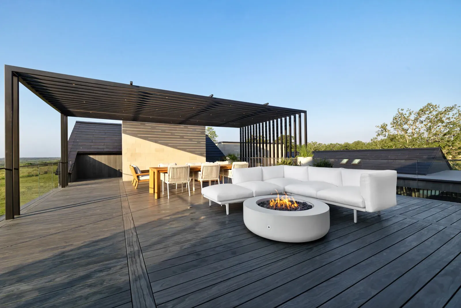 Rooftop outdoor kitchen with a pergola and firepit in Austin