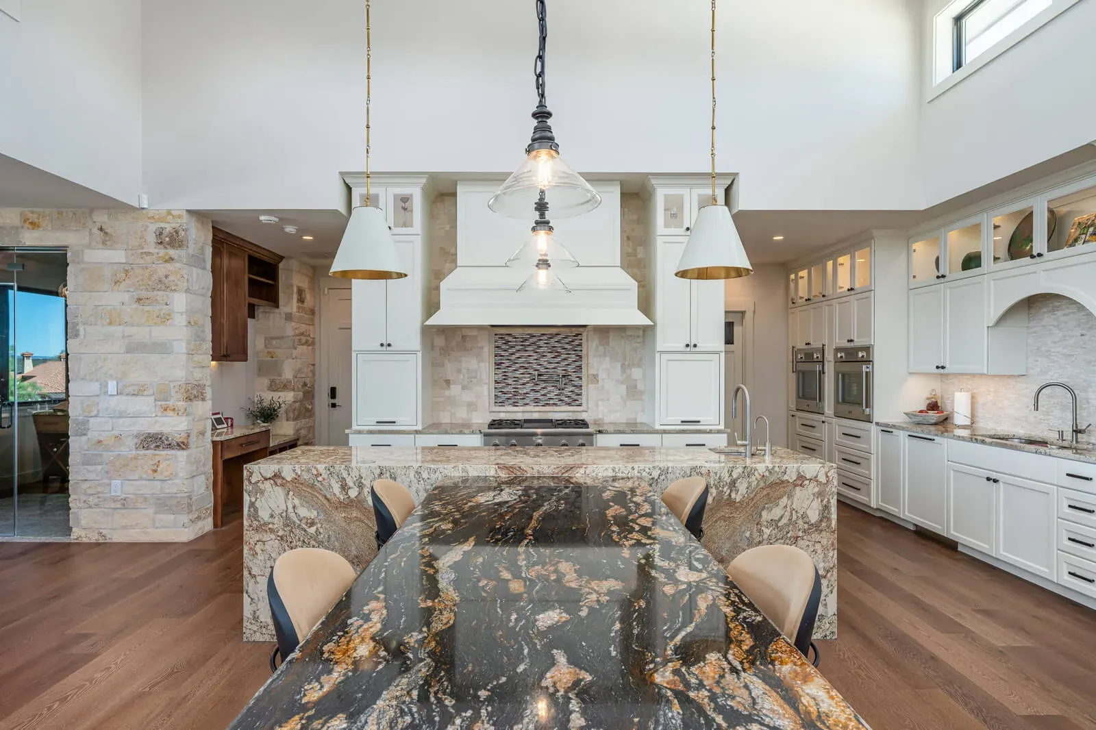 Modern white kitchen with integrated statement hood in Austin