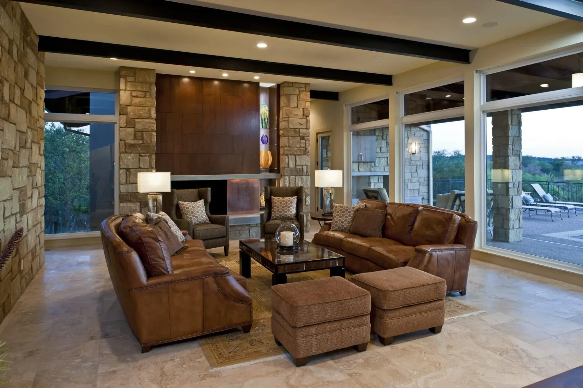 Single-story luxury great room with a wood ceiling and glass opening to the outdoors
