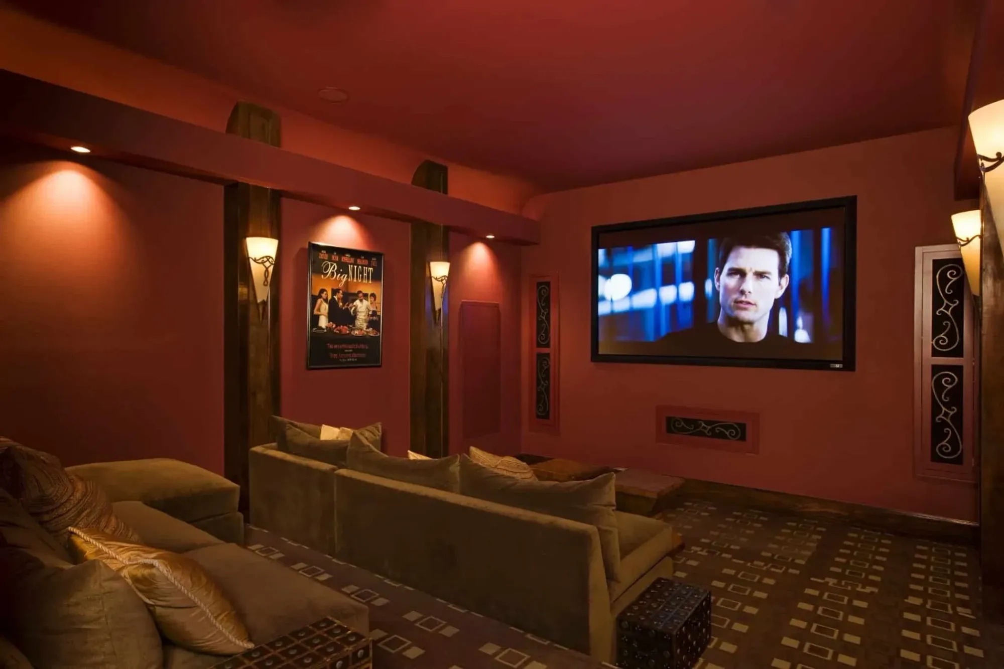 Media room with projection screen and lounge seating in a Jenkins Parade of Homes residence