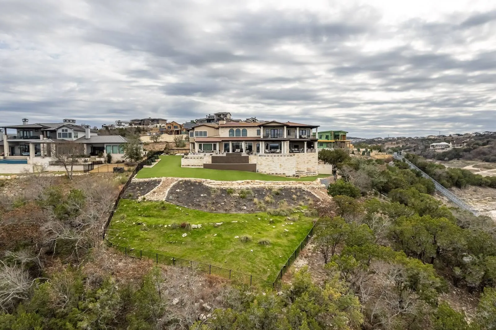 Custom home building on your land in Texas Hill Country, hillside lot with completed Jenkins Design Build home