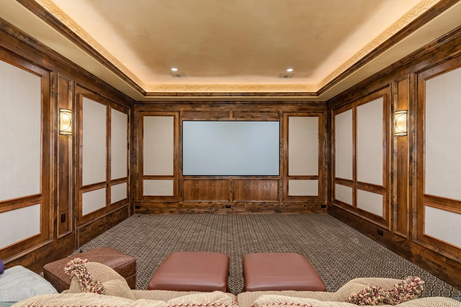 Traditional private home theater with wood paneling